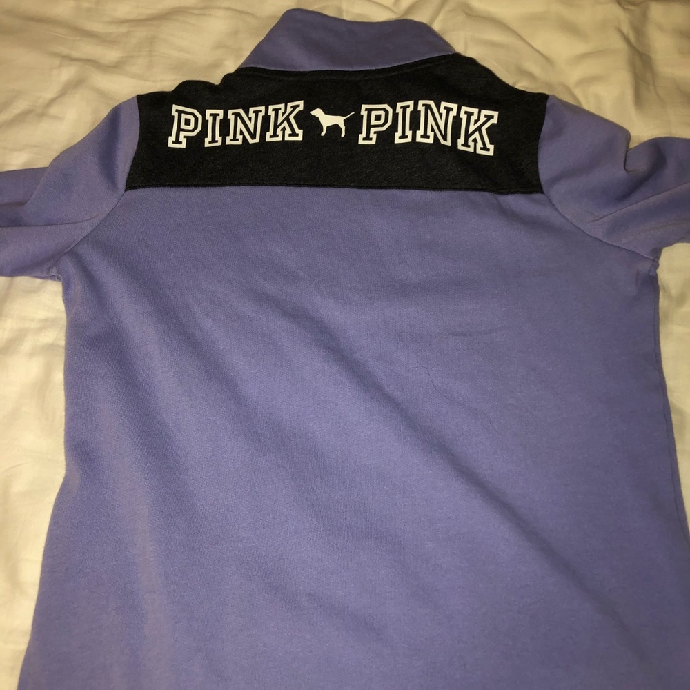 Pink half zip jacket.